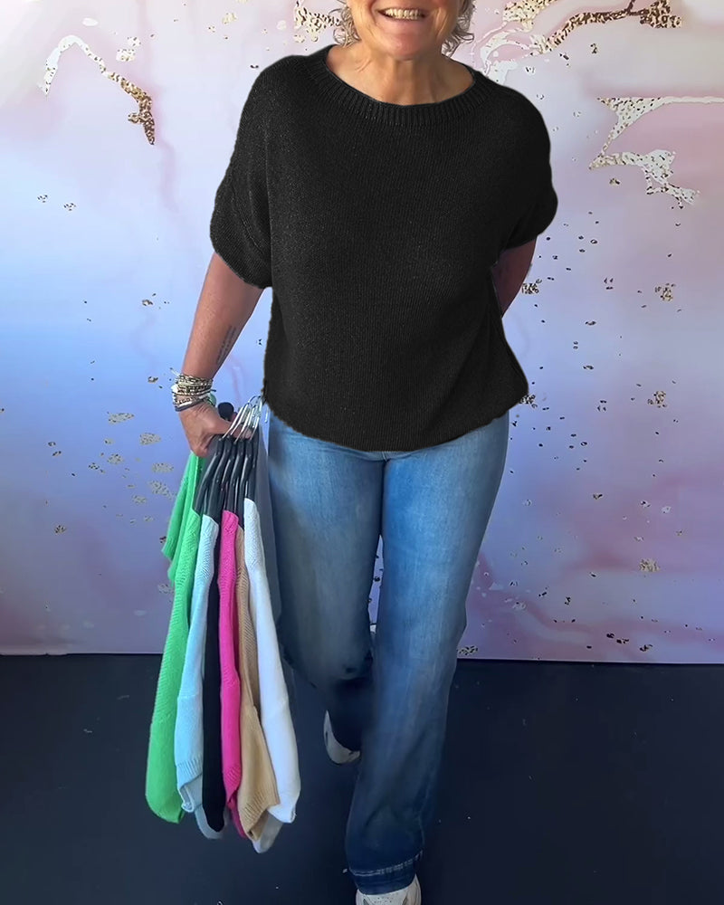 Løs ensfarvet pullover med rund hals