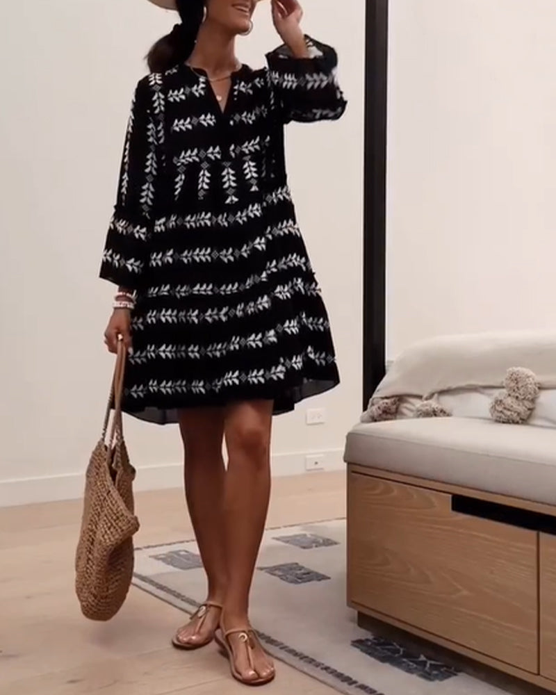 Elegant kort kjole med modeprint