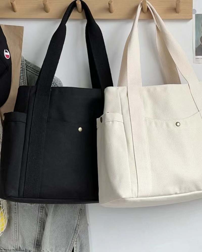 Kanvastaske med dobbelte hanke og stor kapacitet