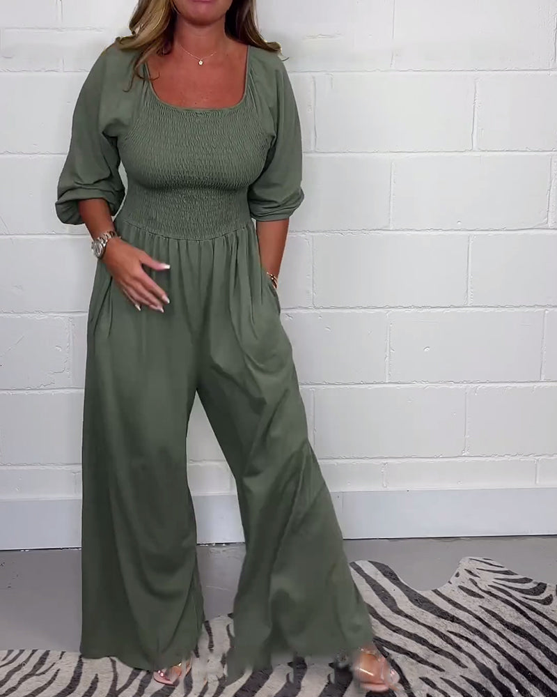 Ensfarvet jumpsuit med firkantet hals