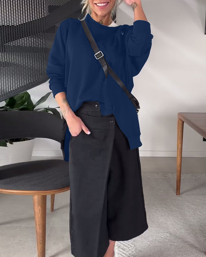 Sort sweater i løs pasform med slids