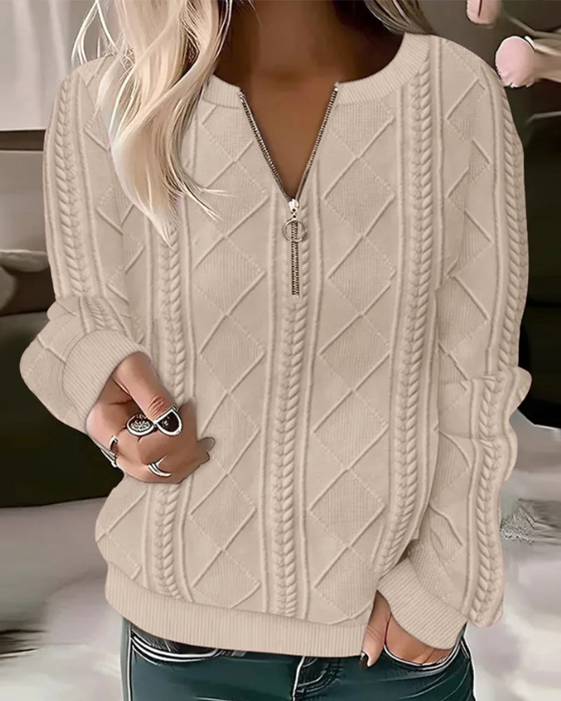 Ensfarvet sweatshirt med lynlås