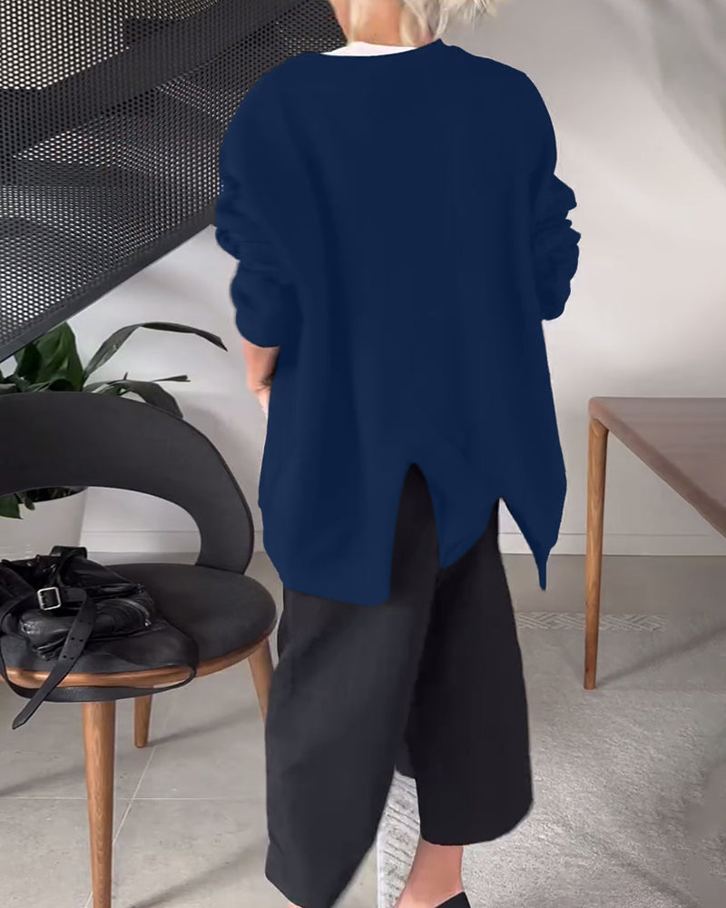 Sort sweater i løs pasform med slids