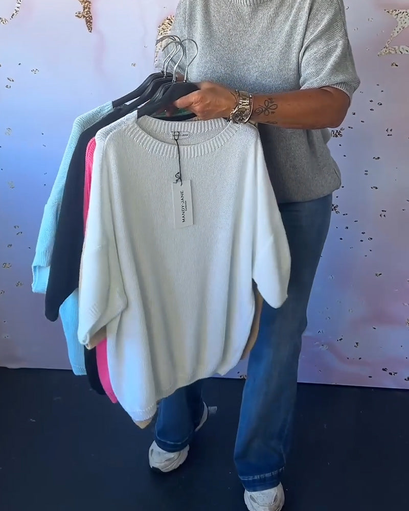 Løs ensfarvet pullover med rund hals