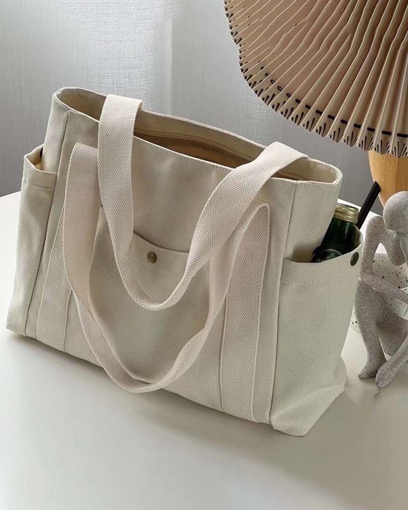 Kanvastaske med dobbelte hanke og stor kapacitet