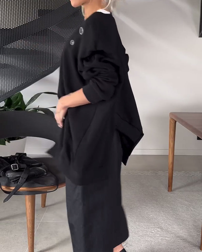 Sort sweater i løs pasform med slids