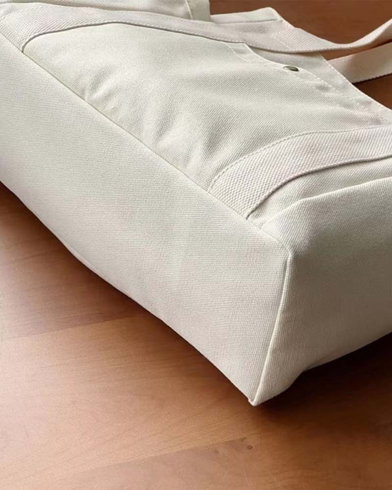 Kanvastaske med dobbelte hanke og stor kapacitet