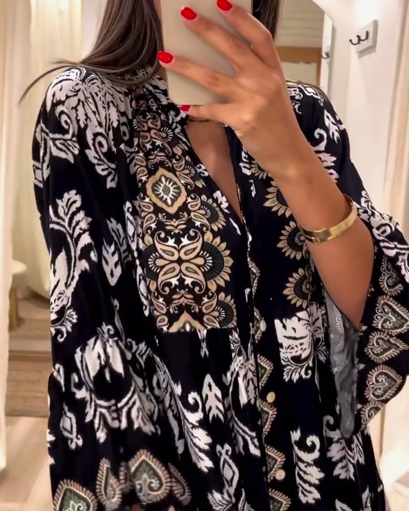 Løs vintage kjole med print og plissering