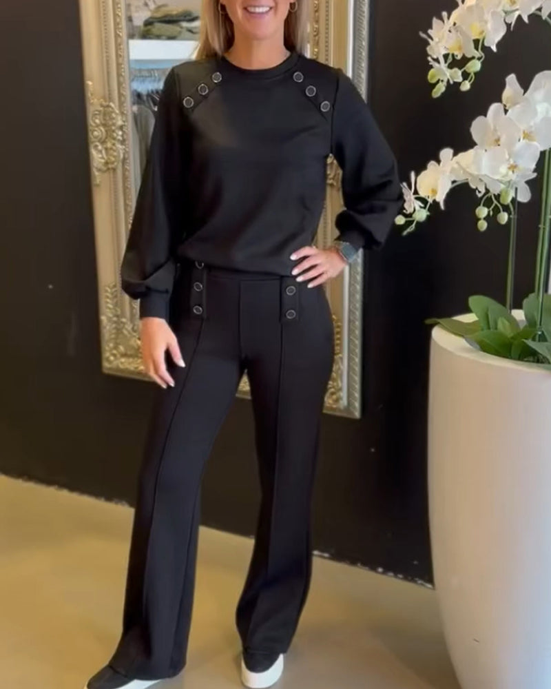 Todelt sæt - Sort bluse og bukser med ringdesign