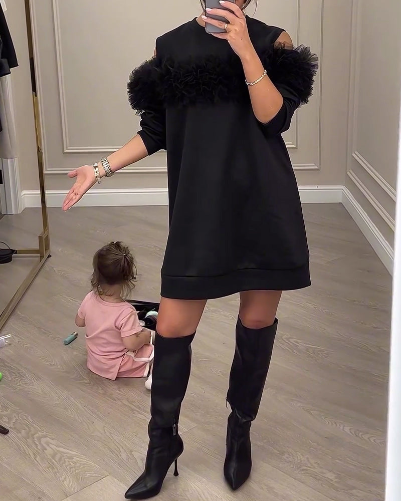 Sort kjole med pelskrave