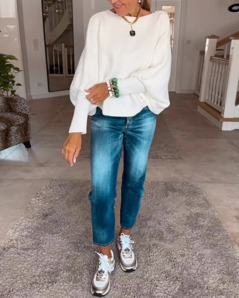 Ensfarvet sweater med lanterneærmer