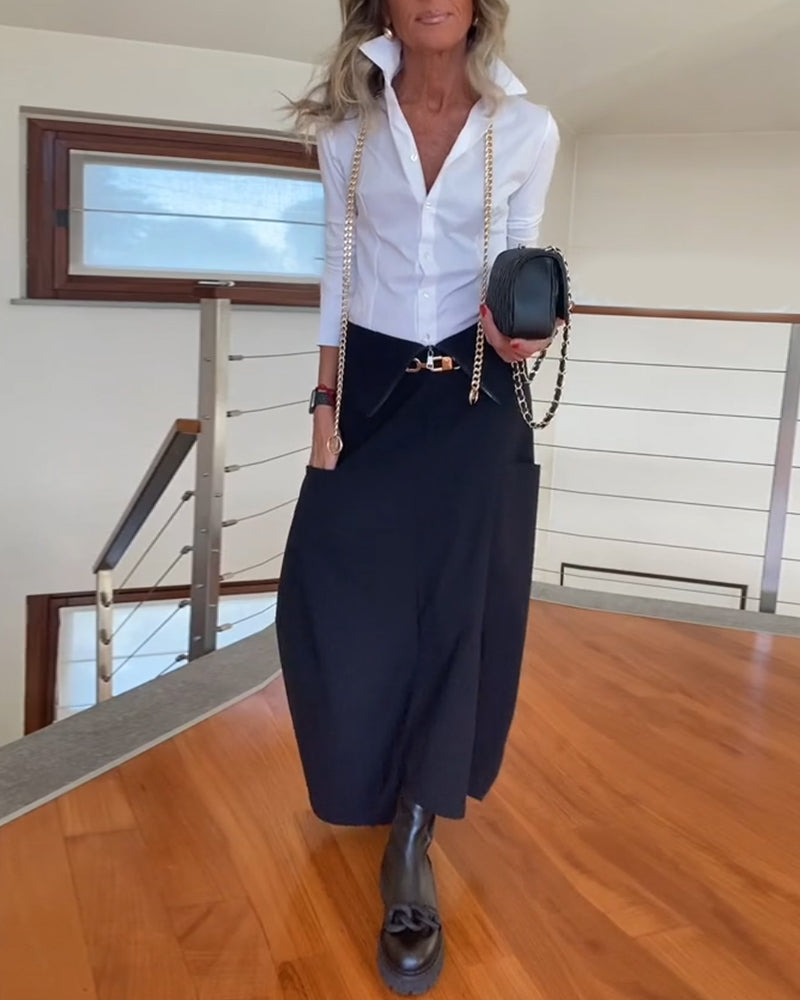 Stilfuld mørk nederdel med lynlåslommer