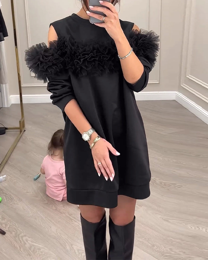 Sort kjole med pelskrave