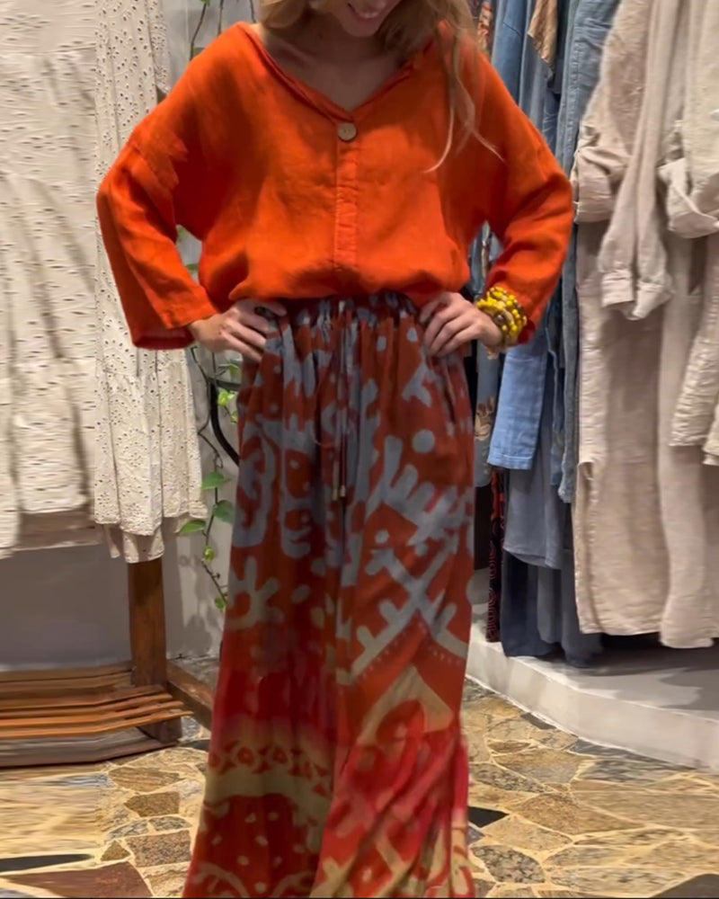 Bredbenede bukser i løs pasform med lommer og print