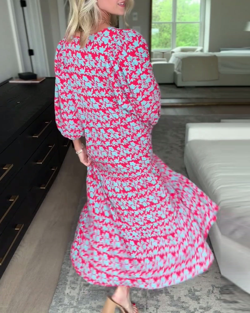 Lang blomsterkjole med V-hals og lanterneærmer