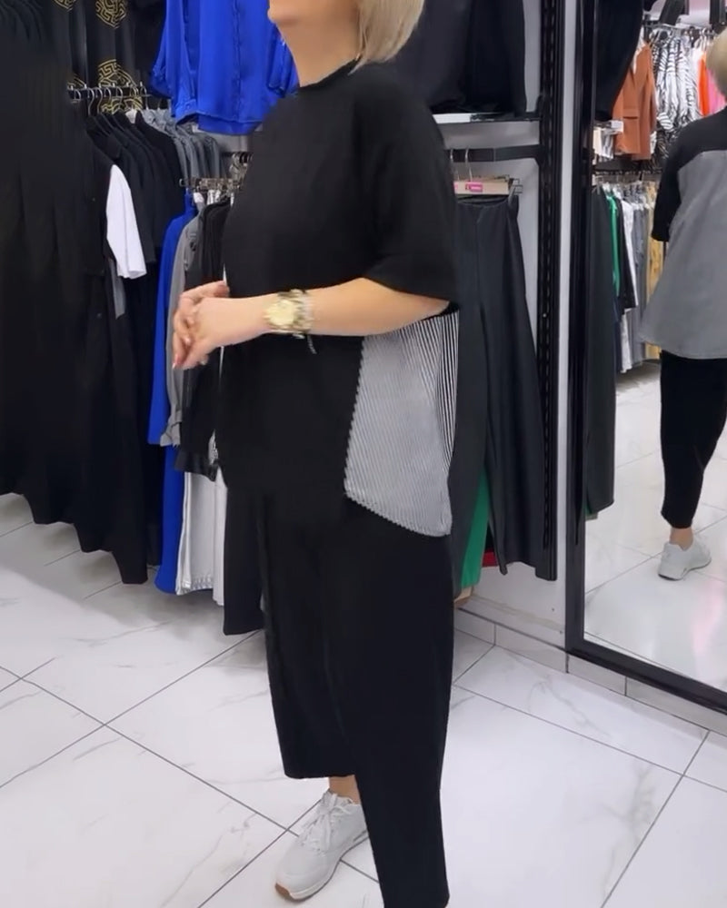 Afslappet sort bluse med nålestribet ryg