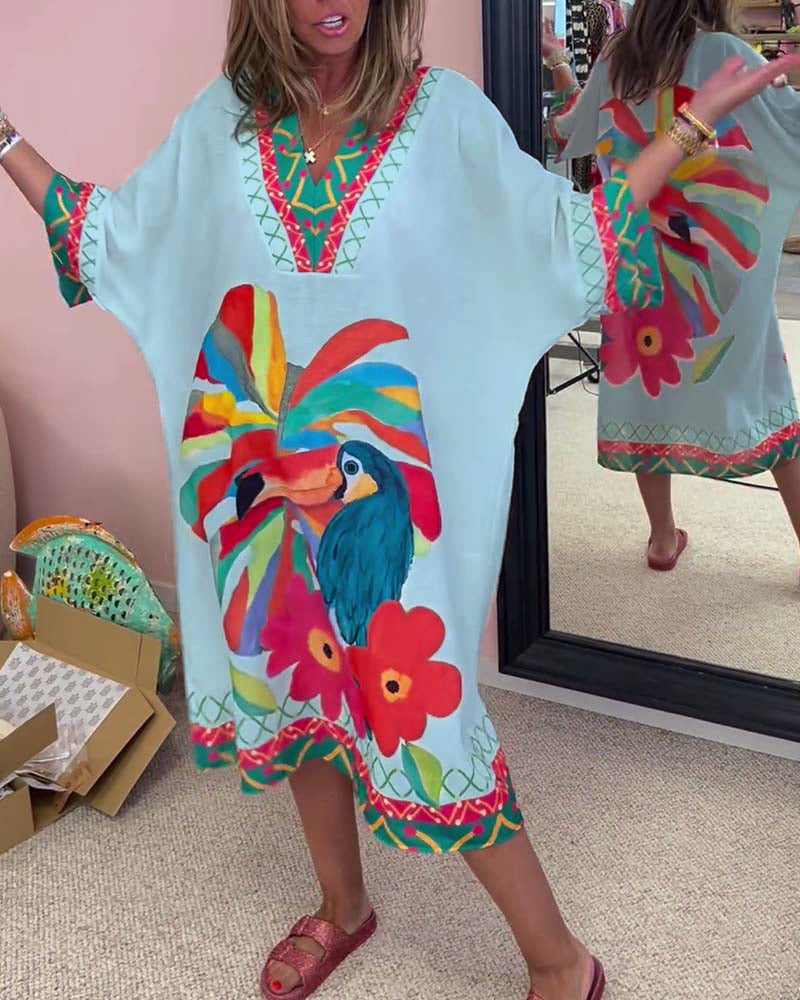 V-halset kjole med tropiske motiver