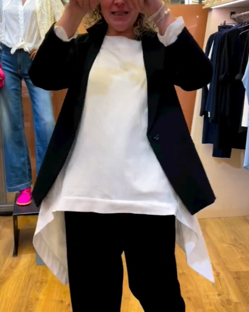 Ensfarvet top med ulige hem