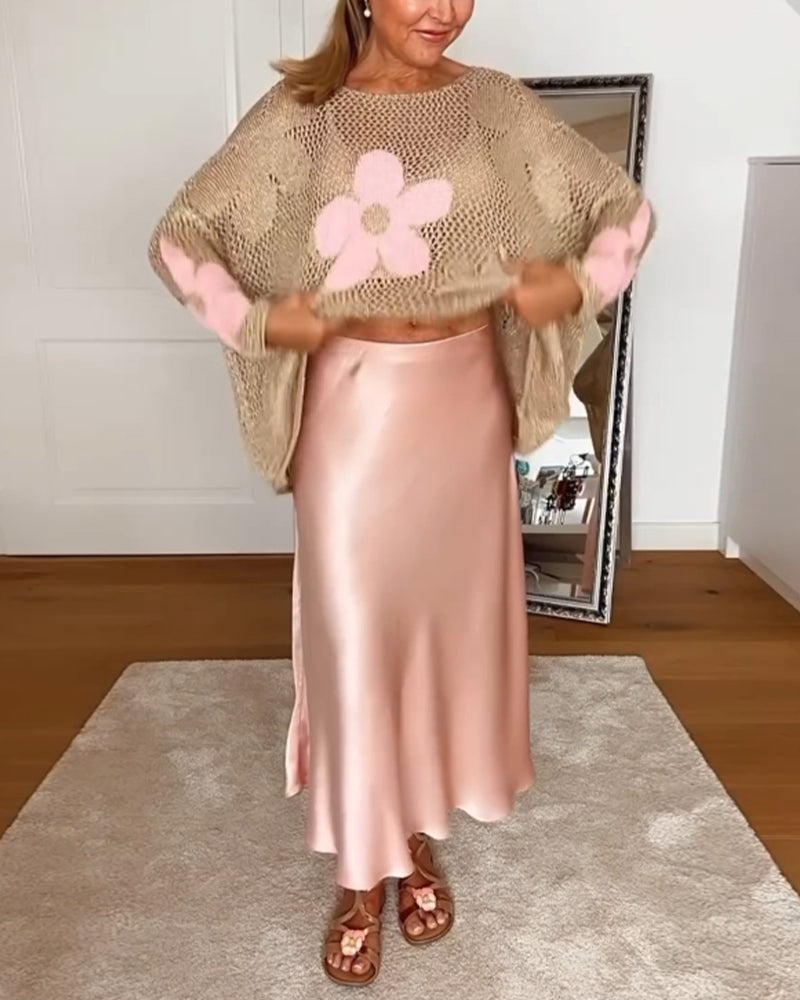 Hulmønstret sweater med blomstermotiver