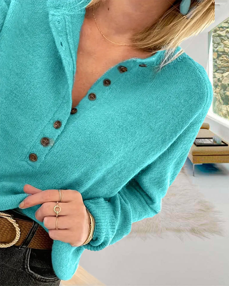Frisk turkisfarvet sweater med henley-krave