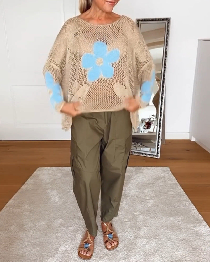 Hulmønstret sweater med blomstermotiver