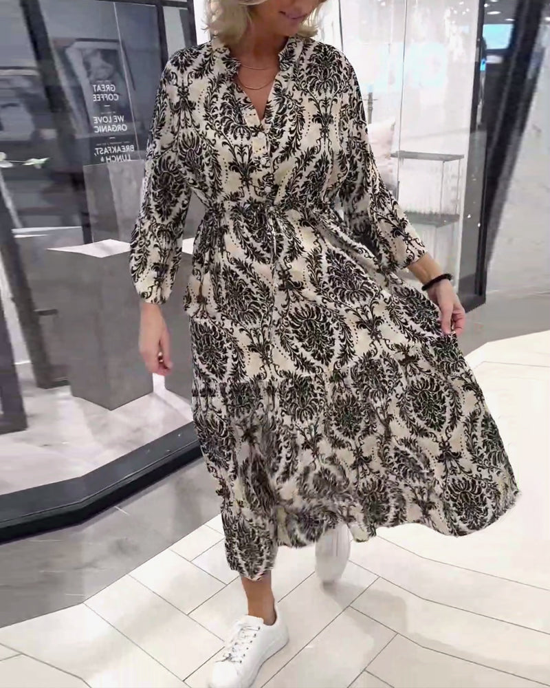 Mønstret kjole med klokkeærmer og snøre