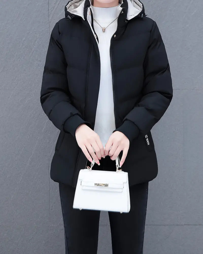 Jakke med afslappet, ensfarvet, varm hætte