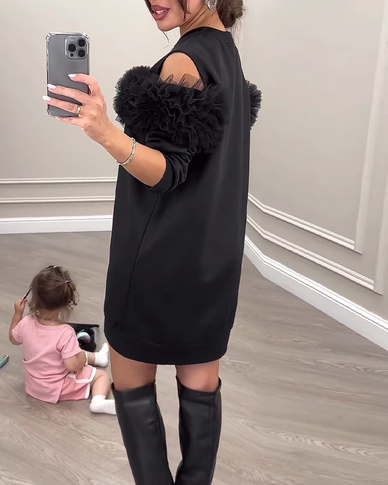 Sort kjole med pelskrave