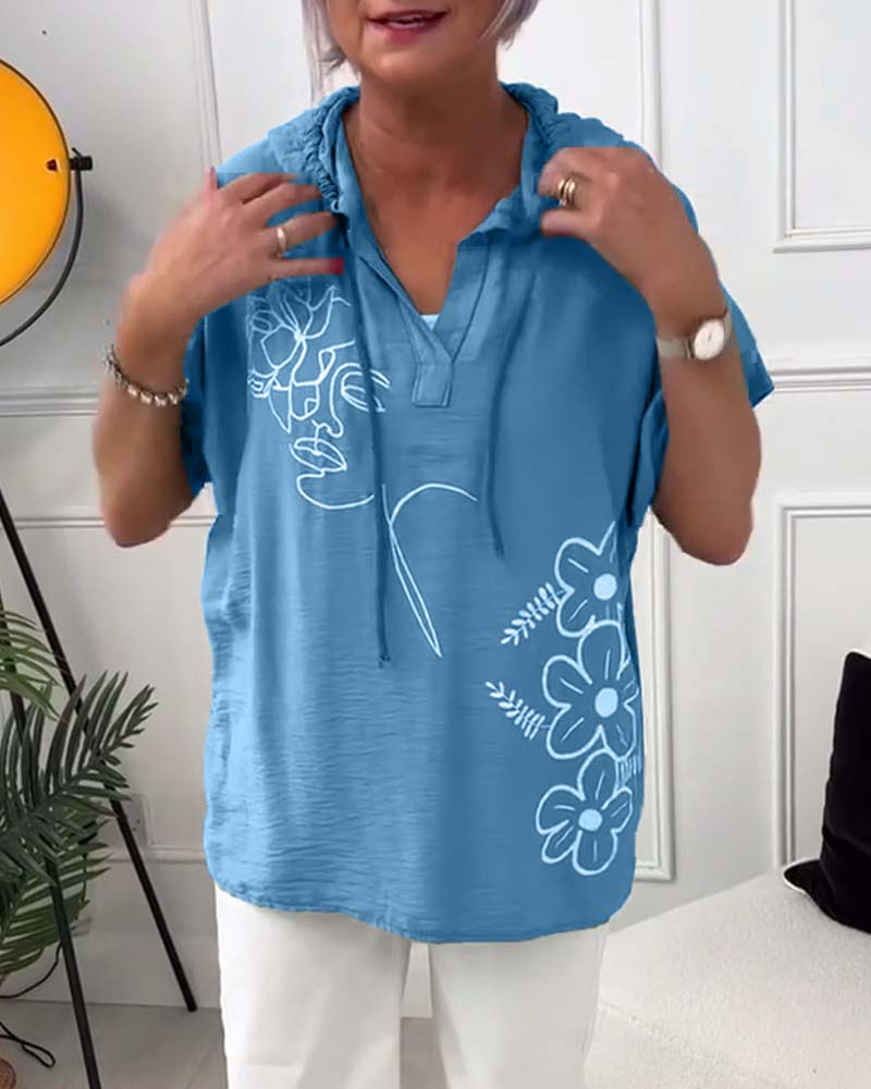 Afslappet hættetrøje med korte ærmer og blomsterprint