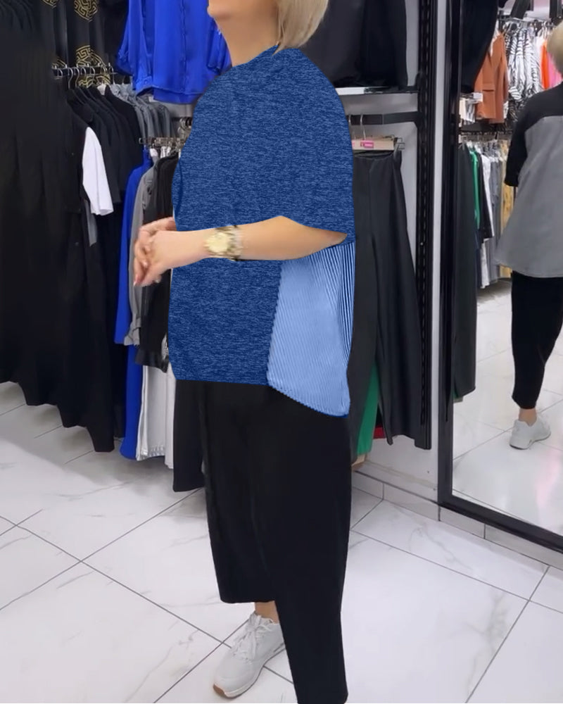 Afslappet sort bluse med nålestribet ryg