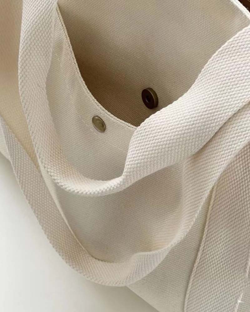 Kanvastaske med dobbelte hanke og stor kapacitet