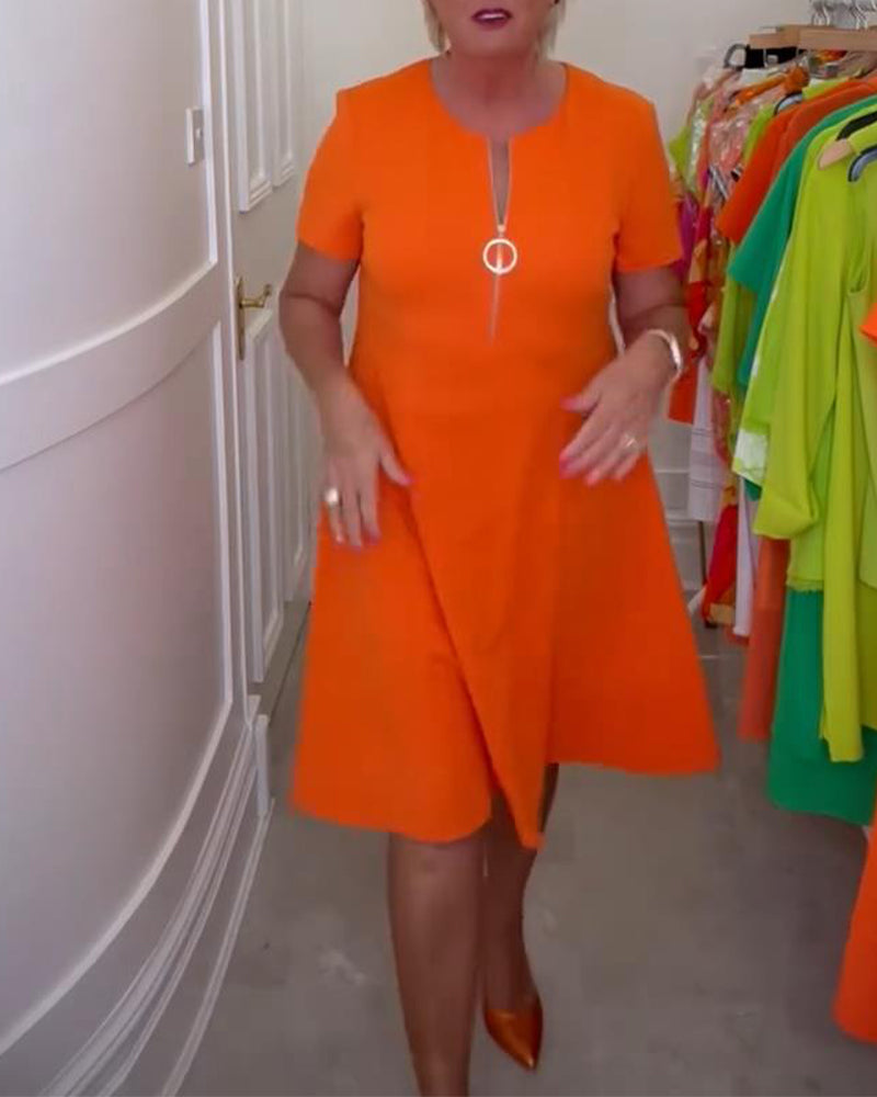 Stilfuld kortærmet orange kjole med lynlås