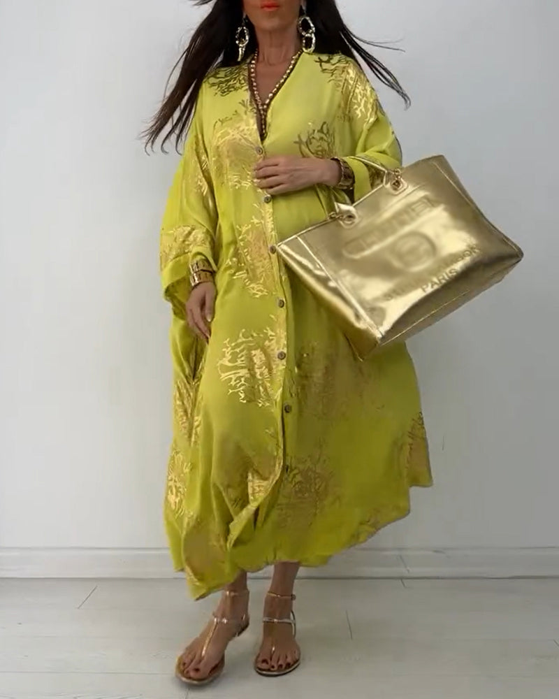 Langærmet oversized kjole med knapper og print