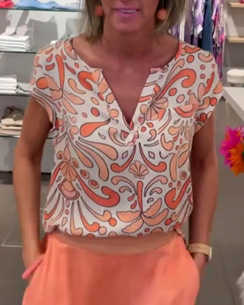 Afslappet bluse med V-udskæring og raglanærmer