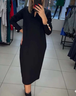 Elegant kjole med perleknapper