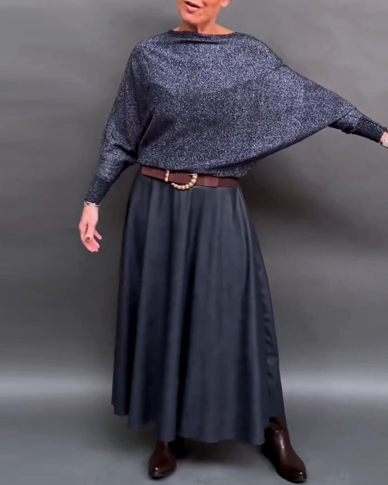 Skinnende top med rund hals og dolmanærmer