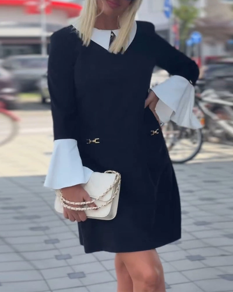 Elegant kjole med klokkeærmer og falsk lagdeling