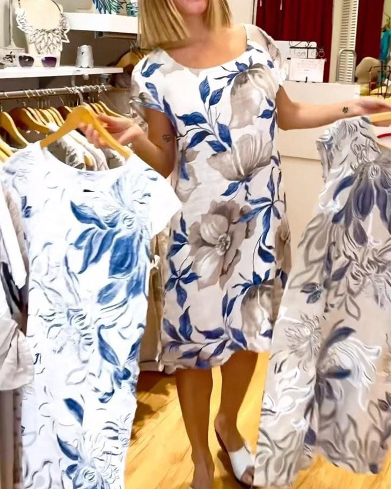 Elegant kortærmet kjole med blomsterprint
