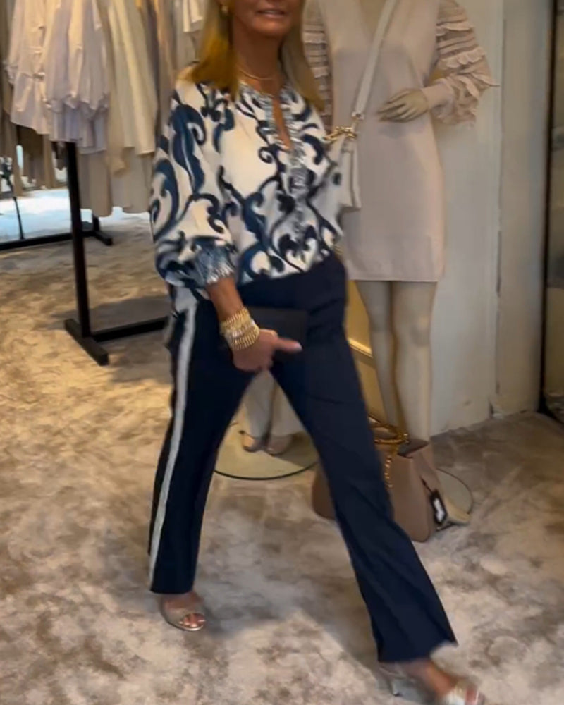 Bluse med lanterneærmer og retromønster