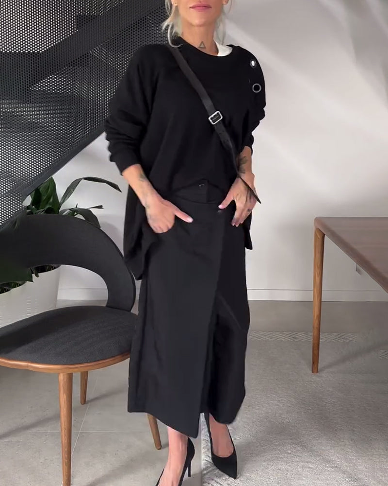 Sort sweater i løs pasform med slids