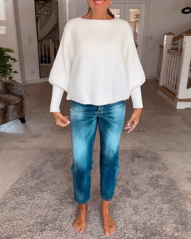 Ensfarvet sweater med lanterneærmer