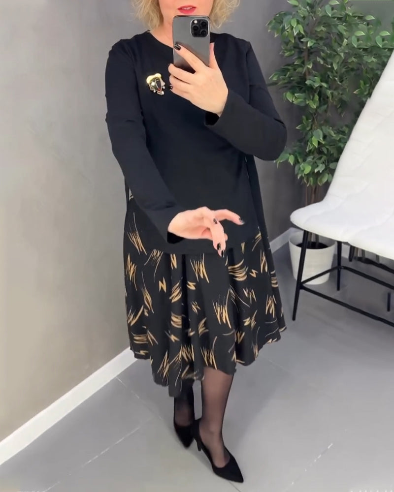 Afslappet kjole med mønstret nederdel