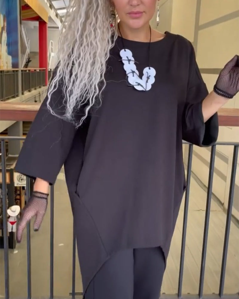 Lang top med knappelukning bagtil