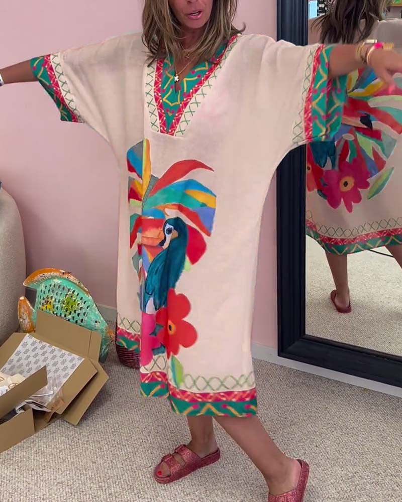 V-halset kjole med tropiske motiver