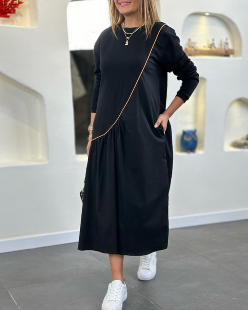 Skiftskjole med lomme og lange ærmer