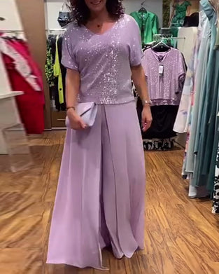 V-halset kortærmet bluse med pailletter