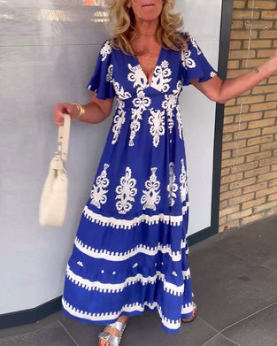 Elegant lang blå kjole med vintage print