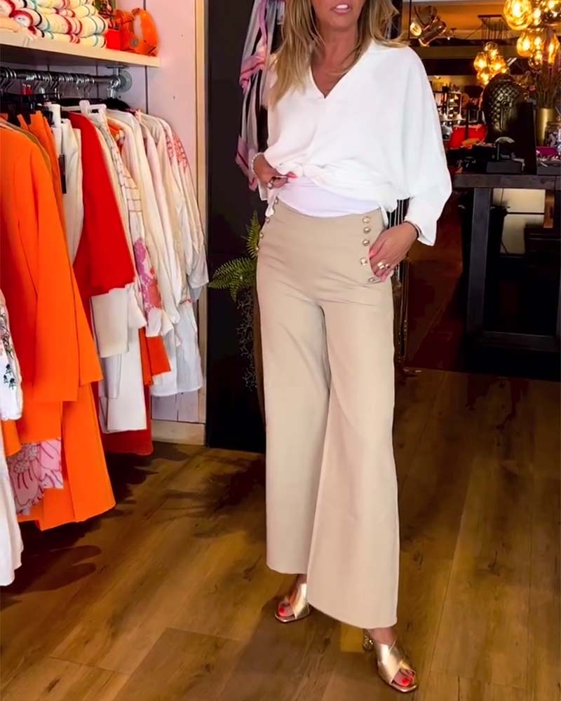 Ensfarvet V-halset bluse med bindestrop