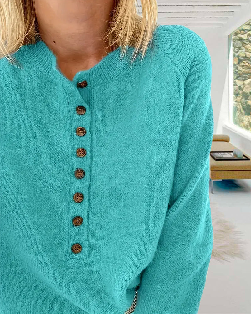 Frisk turkisfarvet sweater med henley-krave