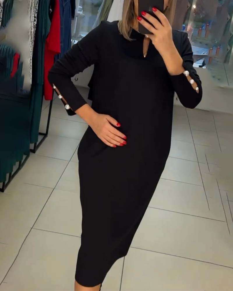 Elegant kjole med perleknapper